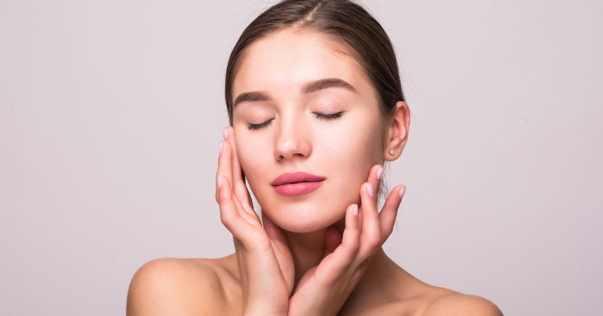 Woman enjoying professional facial treatment – glowing and hydrated skin after Skin Care Chevy Chase spa session.