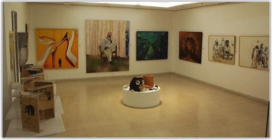 Interior of an Online Art Gallery Karachi with vibrant modern paintings and creative installations.